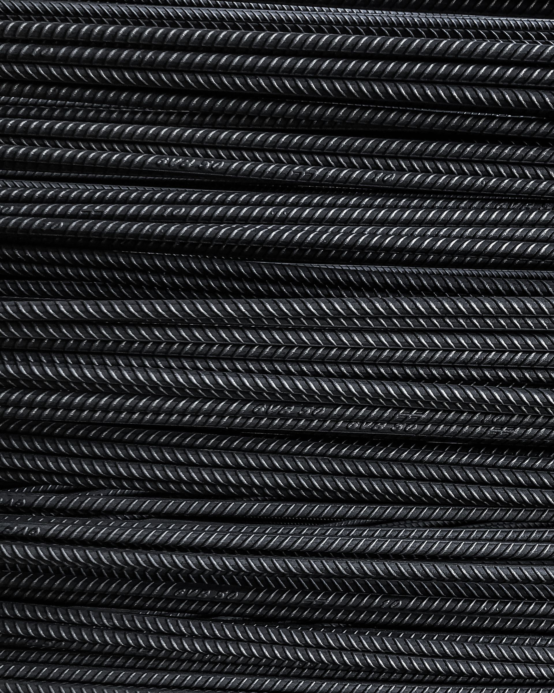 Dense stack of steel reinforcement bars for industrial supply